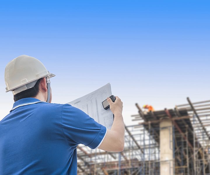 Engineer is inspecting his work in building construction site